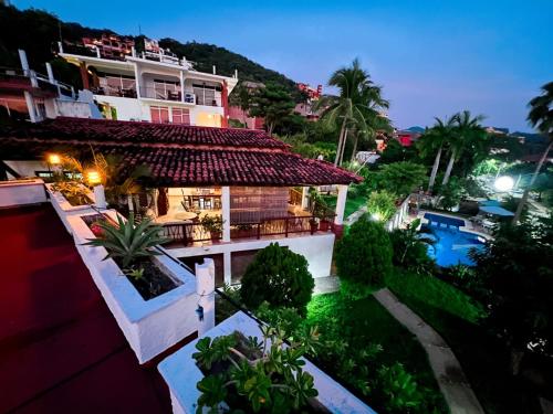 an aerial view of a house with a swimming pool at Hotel Villas Ema in Zihuatanejo