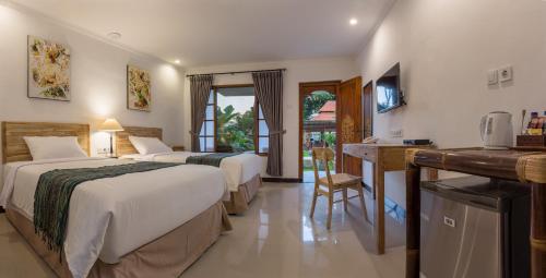 Llit o llits en una habitació de Sanur Lodge