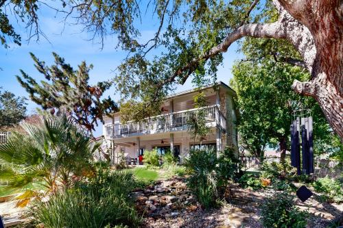 an exterior view of a house with trees and plants at Bay Point Paradise in Horseshoe Bay