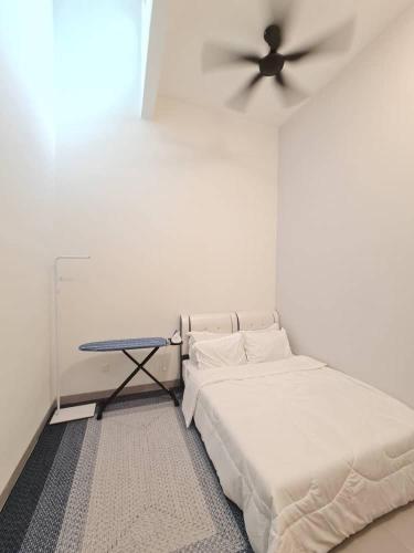 a bedroom with a bed and a ceiling fan at One Sweet Homestay Kulim Hi-Tech utk Msliim shj in Kulim