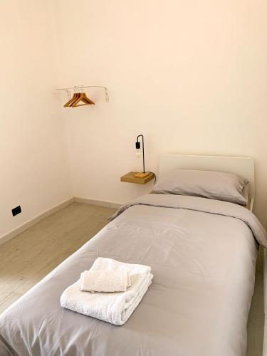 Ένα ή περισσότερα κρεβάτια σε δωμάτιο στο Le Vie del Borgo