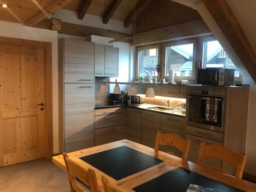 Kuchyň nebo kuchyňský kout v ubytování Chalet Ancienne Poste