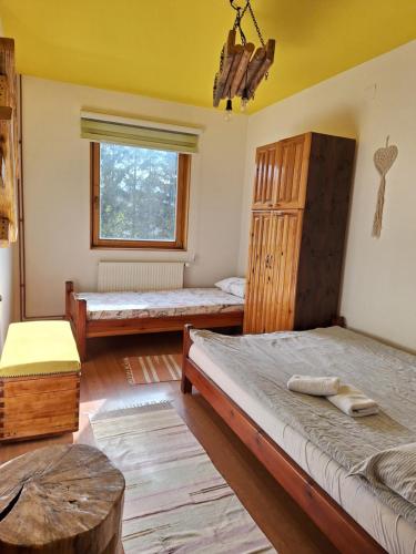 Postel nebo postele na pokoji v ubytování Apartmani Nika Zlatibor