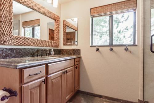 a bathroom with a sink and a shower at Snowflower #47 - Updated 2 Bedroom & Loft, 3 Bath, Sleeps 8, Steps away from Free Town Shuttle in Mammoth Lakes