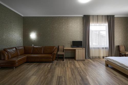 TV a/nebo společenská místnost v ubytování Podil City View