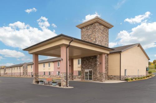 a rendering of a building with a tower at Quality Inn Newton at I-80 RECENTLY ALL ROOMS RENOVATED 2023 in Newton