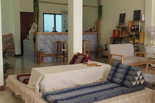a living room with a couch and a table at Poke Pai Home in Pai