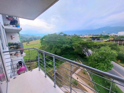 a balcony of a building with a view of a field at Apartamento en Ibagué - parque deportivo in Ibagué