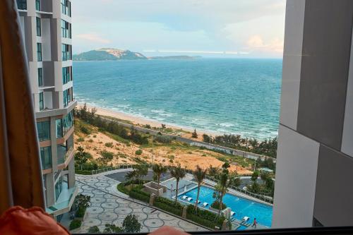 a view of the ocean from a building at Apec Mandala Wyndham Mui Ne Ngoc Linh in Mui Ne