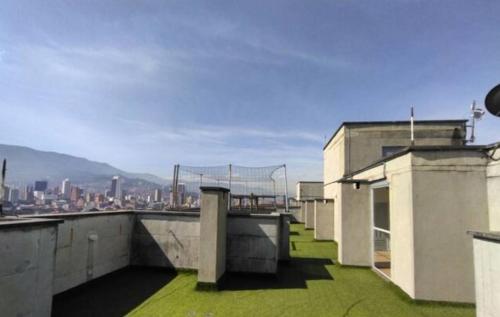 a view of a city from the roof of a building at Habitación nivel 13 - cama doble in Medellín