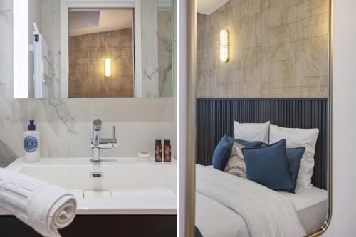 - une chambre avec un lit blanc et un lavabo dans l'établissement Apartment Saint Germain des Prés by Studio prestige, à Paris