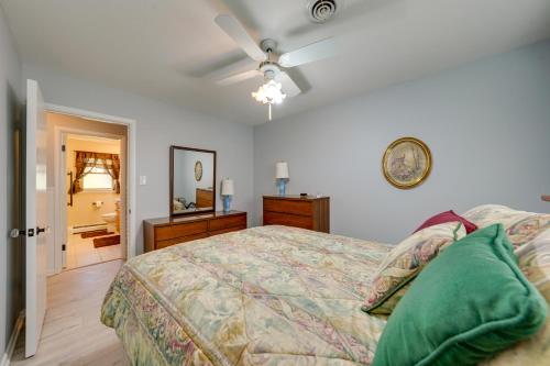 a bedroom with a bed and a ceiling fan at Cotys House Dog-Friendly Illinois Abode with Bar! in Streator