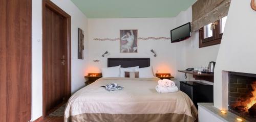 Postel nebo postele na pokoji v ubytování Hotel Petradi