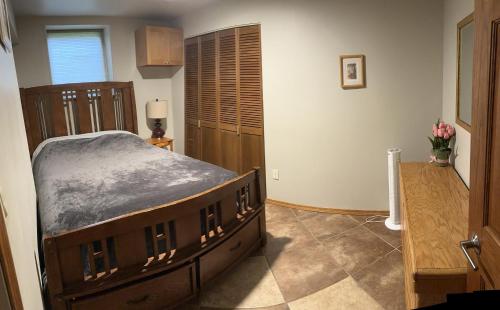 a bedroom with a large bed in a room at Forget me not Home in Anchorage