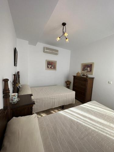 Кровать или кровати в номере Casa Flores