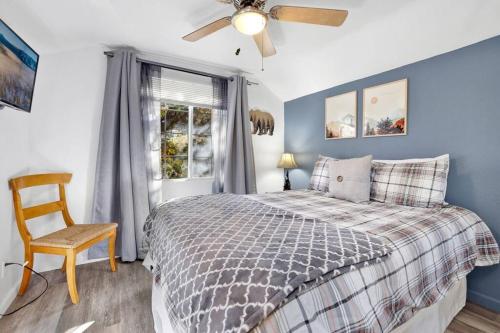 a bedroom with a bed and a ceiling fan at Apres Chalet Retreat~ Hot Tub~ Relax Away Cottage~ in Sugarloaf