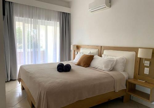 Un pat sau paturi într-o cameră la Bahia Residence Cabarete