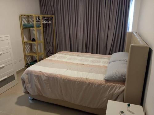 Postel nebo postele na pokoji v ubytování Apartamento Céntrico en Santo Domingo 5F