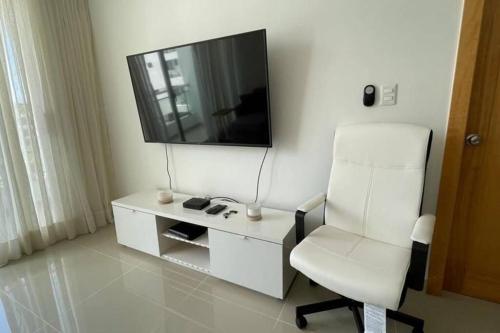 TV a/nebo společenská místnost v ubytování Apartamento Céntrico en Santo Domingo 5F