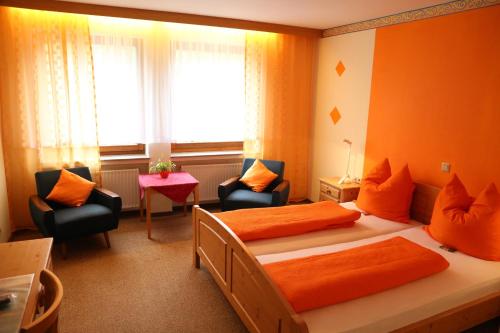 Postel nebo postele na pokoji v ubytování Hotel Bechtel