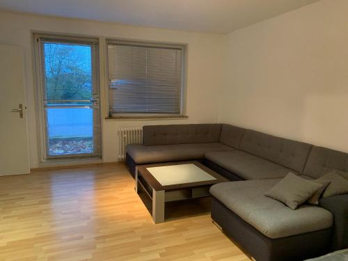 a living room with a couch and a coffee table at Ein-Zimmer-Wohnung Solingen in Solingen