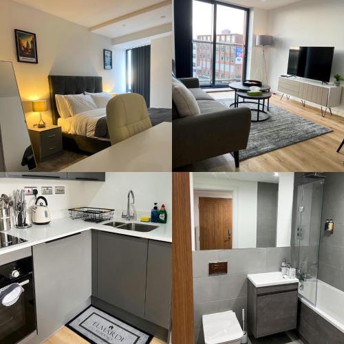 a kitchen and a living room with a bed at Elmardi Residence - 2 Bedroom Apartment City Centre in Birmingham