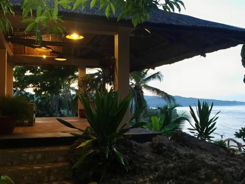 a house with a view of the ocean at Siargao Million Dollar View in Burgos