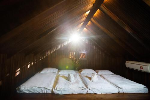 Llit o llits en una habitació de Arundina