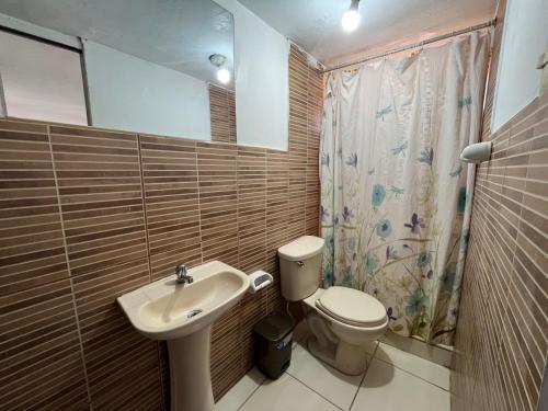 a bathroom with a toilet and a sink at Cusco Plaza de Armas in Cusco