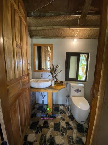 a bathroom with a sink and a toilet at Pu Luong Ecostay in Lũng Tiềm