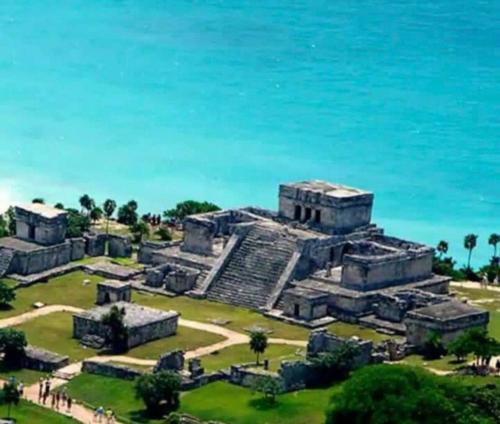 an aerial view of the ruins of the mayan city at Departamento AJAL TULUM in Tulum