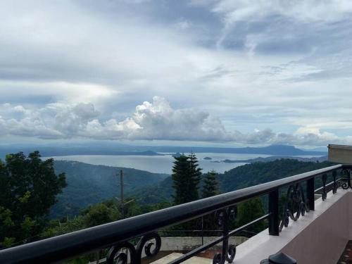 a view of the water from a balcony at Burgitos Homescape Tagaytay in Tagaytay