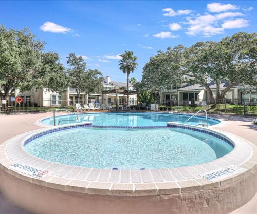 a large swimming pool in the middle of a resort at Tranquil Bay RRYC50 in Rockport