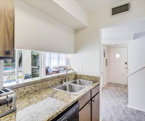 a kitchen with a sink and a large window at Tranquil Bay RRYC50 in Rockport