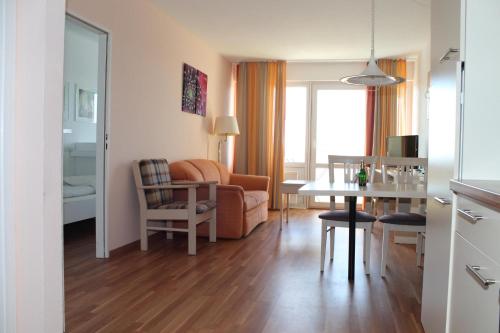 a living room with a couch and a table at Ferienwohnung E623 für 2-4 Personen an der Ostsee in Brasilien