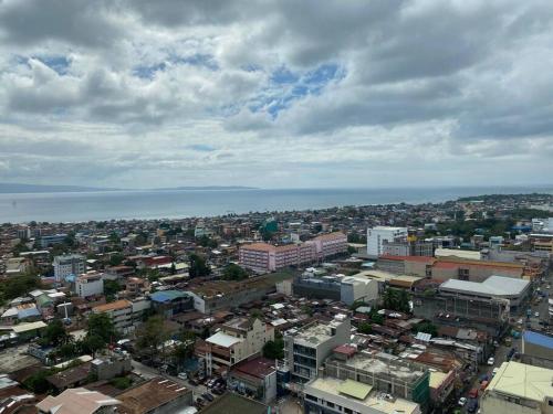 an aerial view of a city with the ocean at Wanderer's Trove in Davao City