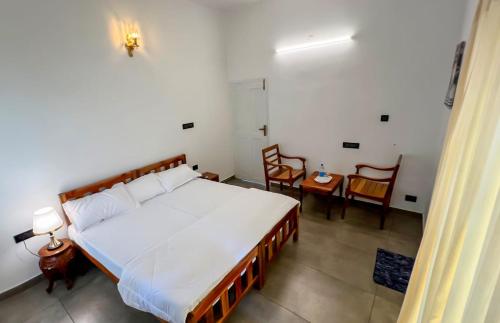 Postel nebo postele na pokoji v ubytování ELZAS FORT iNN