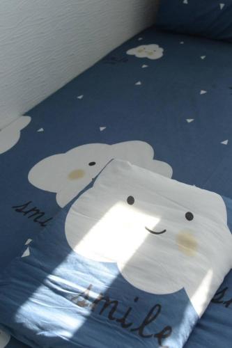 Ένα ή περισσότερα κρεβάτια σε δωμάτιο στο Green Island Starry Night Hostel