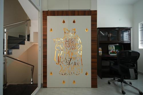 an office with a door with an owl on it at Aayushman Luxury Homes in Sarjāpur