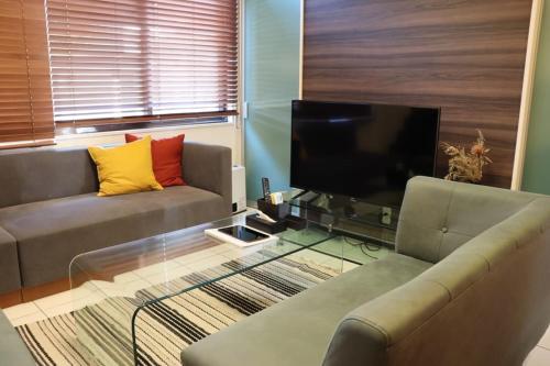 TV a/nebo společenská místnost v ubytování ロハスResort宮浦