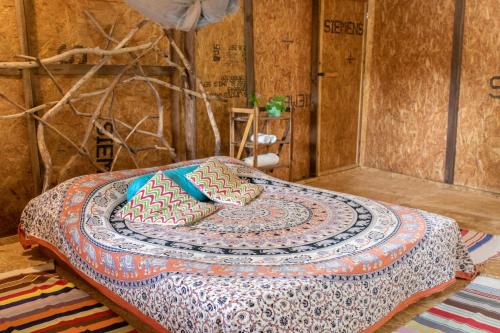 a bed with two pillows on it in a room at Saraya in Sangolda