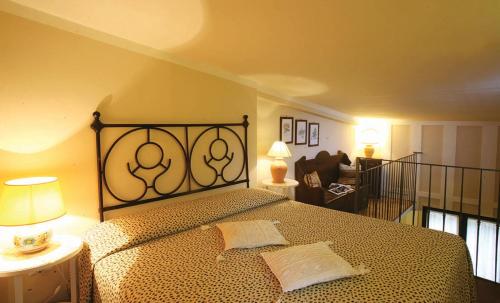 a bedroom with a bed and a living room at Malvarina in Capodacqua