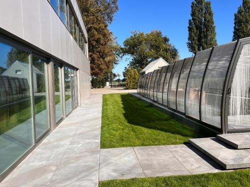 a row of windows on the side of a building at LedowoHouse Industrial Style kids friendly in Lędowo