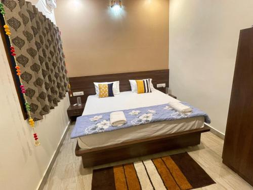 Postel nebo postele na pokoji v ubytování Tattva Paying guesthouse