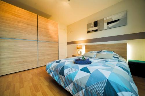 Ένα ή περισσότερα κρεβάτια σε δωμάτιο στο Appartement lumineux, 80m², proche des Vosges