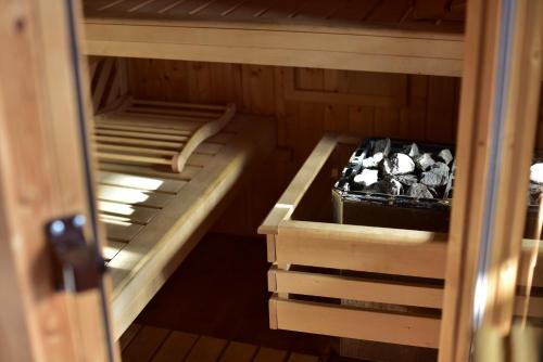 an empty sauna with a tub in the middle at Ferienhaus Seetaler Alpen in Obdach