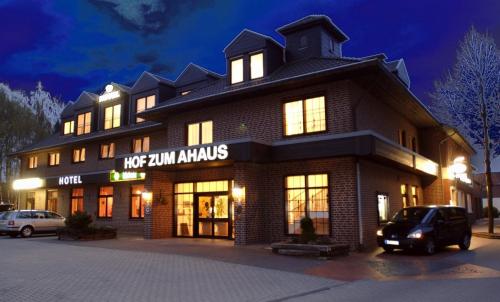 a building with a car parked in front of it at Garni Hotel Hof zum Ahaus in Ahaus