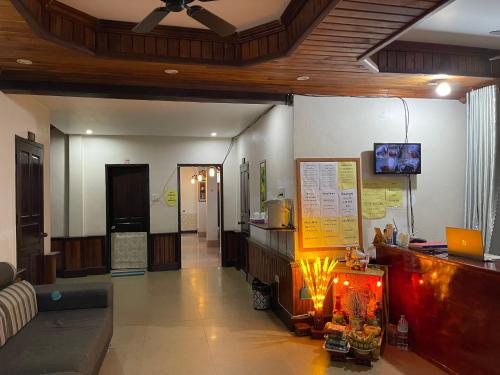 a living room with a couch and a ceiling at Liberty Place in Luang Prabang