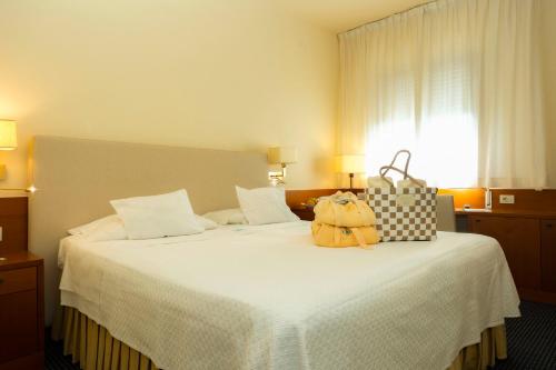 Katil atau katil-katil dalam bilik di Hotel Garden Terme