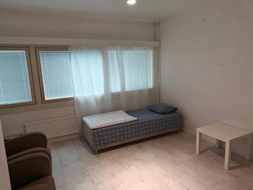 Pet-friendly 4 Bed Apt in Turku with Park views tesisinde bir odada yatak veya yataklar